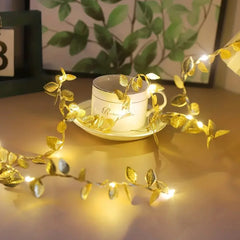 Ihomed Flower Christmas Gold Leaf String Lights Artificial Vine Fairy Lights Battery Powered Christmas Tree Garland Light for Weeding Home Decor